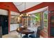 Kitchen features a breakfast nook with a view of the outdoor deck and greenery at 4820 Coppedge Trl, Peachtree Corners, GA 30096