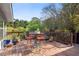 Inviting outdoor deck with a table and seating, perfect for enjoying the surrounding greenery and outdoor living at 4820 Coppedge Trl, Peachtree Corners, GA 30096