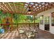 Outdoor deck features an open lattice roof and plenty of seating with wooded views at 4820 Coppedge Trl, Peachtree Corners, GA 30096