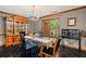 Elegant dining room with black tile floors, glass-top table, and a large china cabinet, perfect for hosting gatherings at 4820 Coppedge Trl, Peachtree Corners, GA 30096