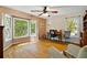 Bright office space features hardwood floors, lots of natural light and windows overlooking a private backyard at 4820 Coppedge Trl, Peachtree Corners, GA 30096