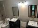 Bathroom featuring double sinks with modern fixtures, framed mirrors, and a combination shower and bathtub at 5147 Roswell Rd # 9, Atlanta, GA 30342