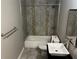 Bathroom featuring a combination shower and bathtub, single sink, and modern vanity at 5147 Roswell Rd # 9, Atlanta, GA 30342