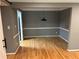 Dining room with wood floors, neutral paint, and modern light fixture at 5147 Roswell Rd # 9, Atlanta, GA 30342