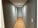 Hallway with wood floors and recessed lighting at 5147 Roswell Rd # 9, Atlanta, GA 30342