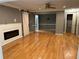 Open living space showcasing hardwood floors, modern fireplace, and ample natural light at 5147 Roswell Rd # 9, Atlanta, GA 30342