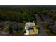 Aerial view of a suburban home featuring a well-manicured lawn and tree-lined street at 6955 Pompas Ct, Douglasville, GA 30135