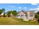 Back exterior of home with large back yard and wood fence at 6955 Pompas Ct, Douglasville, GA 30135