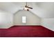 Vaulted ceiling bedroom featuring large window, ceiling fan and neutral walls at 6955 Pompas Ct, Douglasville, GA 30135