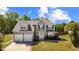 Charming two-story home with a well-manicured lawn and two-car garage at 6955 Pompas Ct, Douglasville, GA 30135