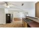 Open kitchen featuring a stainless steel sink, and access to the living room at 6955 Pompas Ct, Douglasville, GA 30135