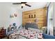 Bedroom designed for a featuring a wood accent wall, dresser, beanbag chair and fun decorations at 85 Lawson St, Buford, GA 30518