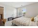 Bedroom with a large window, black bed frame, and a guitar amplifier at 85 Lawson St, Buford, GA 30518