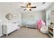 Charming Bedroom featuring a crib, changing table and soft pastel accents at 85 Lawson St, Buford, GA 30518