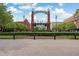 Welcoming entrance to the Mall of Georgia neighborhood featuring decorative arches and lush landscaping at 85 Lawson St, Buford, GA 30518