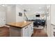 Spacious kitchen with butcher block island that opens to living and dining rooms at 85 Lawson St, Buford, GA 30518