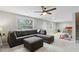 Spacious living area with plush gray sectional sofa and plenty of room for ' play area at 85 Lawson St, Buford, GA 30518