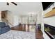 Living room showcasing hardwood floors, staircase, and fireplace at 85 Lawson St, Buford, GA 30518