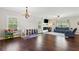 Bright and airy living room featuring hardwood floors, fireplace and recessed lighting at 85 Lawson St, Buford, GA 30518