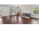 Spacious living room featuring hardwood floors, large windows and an abundance of natural light at 85 Lawson St, Buford, GA 30518