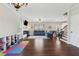 Bright living room features hardwood floors, modern fireplace, and playroom area at 85 Lawson St, Buford, GA 30518