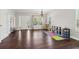 Spacious living room featuring hardwood floors, large windows and an abundance of natural light at 85 Lawson St, Buford, GA 30518