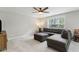 Spacious living room with comfortable sectional sofa, ottoman, and plenty of natural light at 85 Lawson St, Buford, GA 30518