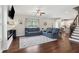 Welcoming living room features hardwood floors, open layout, and access to kitchen at 85 Lawson St, Buford, GA 30518