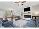 Open living room features modern fireplace, playroom, and comfortable seating area at 85 Lawson St, Buford, GA 30518