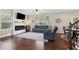 Inviting living room features a modern fireplace, hardwood floors, and cozy seating at 85 Lawson St, Buford, GA 30518