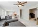 Spacious carpeted living area featuring a modern ceiling fan and access to home gym at 85 Lawson St, Buford, GA 30518