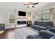 Comfortable living room with hardwood floors, modern fireplace, and window views at 85 Lawson St, Buford, GA 30518