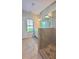 Bright bathroom featuring a glass shower stall, tile flooring and a vanity with white cabinetry at 2102 Talmai Dr, Snellville, GA 30078