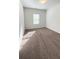 Carpeted bedroom with a window allowing natural light at 2102 Talmai Dr, Snellville, GA 30078