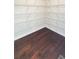 This closet has wooden floors and metal shelves at 2102 Talmai Dr, Snellville, GA 30078