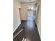 Inviting foyer with hardwood floors and natural light streaming through the open front door at 2102 Talmai Dr, Snellville, GA 30078