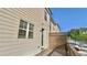 Exterior shot of the apartment features a private deck with wooden railings and beige siding at 2102 Talmai Dr, Snellville, GA 30078
