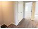 Hallway with carpeted floors and a double door closet at 2102 Talmai Dr, Snellville, GA 30078