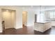 Open-concept kitchen boasts a central island, modern pendant lighting, and stainless steel appliances at 2102 Talmai Dr, Snellville, GA 30078
