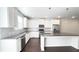 Stylish kitchen with white cabinets, granite countertops, stainless steel appliances, and center island at 2102 Talmai Dr, Snellville, GA 30078