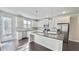 Bright kitchen featuring granite counters, stainless appliances, and ample counter space for cooking at 2102 Talmai Dr, Snellville, GA 30078