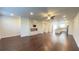 Spacious living room with wood floors, fireplace, and open floor plan to the kitchen at 2102 Talmai Dr, Snellville, GA 30078