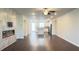 Open floor plan, featuring an electric fireplace and a view to the kitchen at 2102 Talmai Dr, Snellville, GA 30078