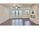 This living room features an electric fireplace and a ceiling fan at 2102 Talmai Dr, Snellville, GA 30078