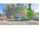 Community playground with slides and swings surrounded by trees and benches at 2102 Talmai Dr, Snellville, GA 30078