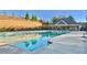 Community pool featuring a large swimming area and a clubhouse at 2102 Talmai Dr, Snellville, GA 30078