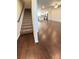 Open staircase leading to the main living area with hardwood floors and modern finishes at 2102 Talmai Dr, Snellville, GA 30078