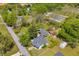 Overhead aerial view of a residential home with lush trees and a garden shed on a large lot, a great view at 215 Fair St, Loganville, GA 30052