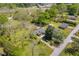 Drone shot of a real estate property showcasing the house, outbuildings and lush surroundings at 215 Fair St, Loganville, GA 30052