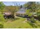 Expansive backyard featuring a shed, with ample space for outdoor activities and enjoying the green surroundings at 215 Fair St, Loganville, GA 30052